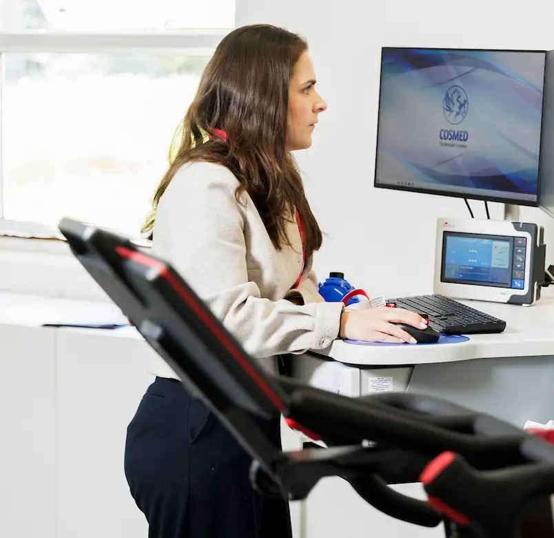 A researcher operates equipment in a lab