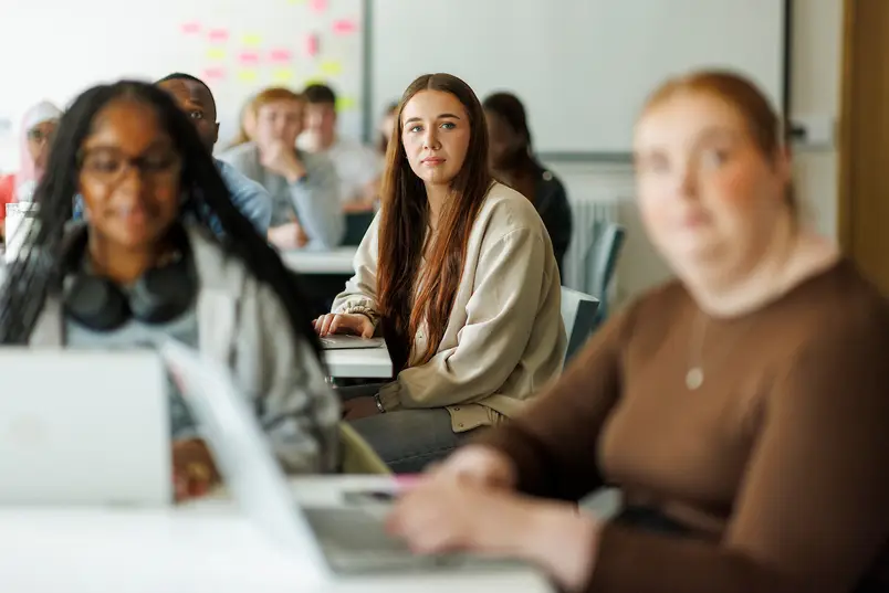 A group of students seated in a class